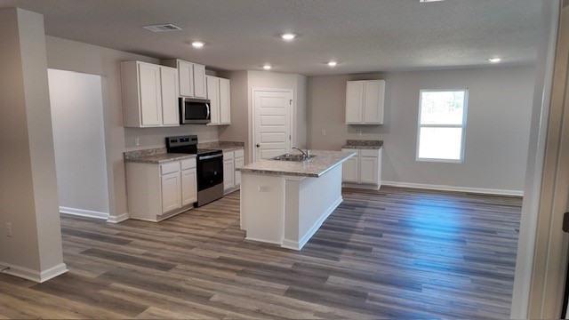 The Lakeside floorplan open concept living, dining and kitchen space