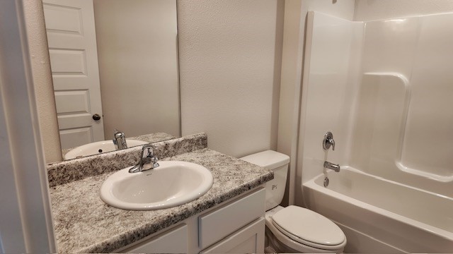 The Lakeside floorplan guest bathroom with single vanity and Formica countertops