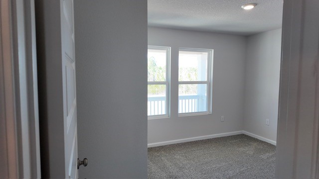 The Lakeside floorplan guest bedroom two with window view