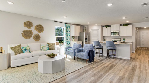 The Highlands Lakeside Model Home open concept living room