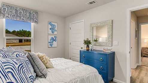 The Highlands Lakeside Model Home guest bedroom two with window