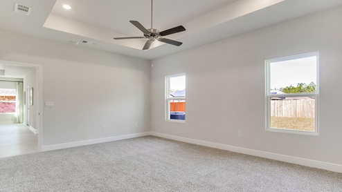 The Camden floorplan primary bedroom with carpet throughout