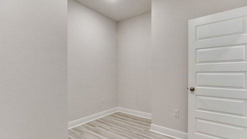 The Camden floorplan laundry room with EVP flooring throughout