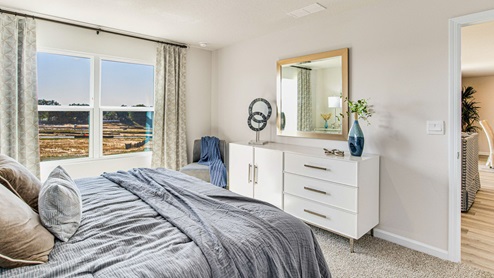 The Lakeside primary bedroom with large window