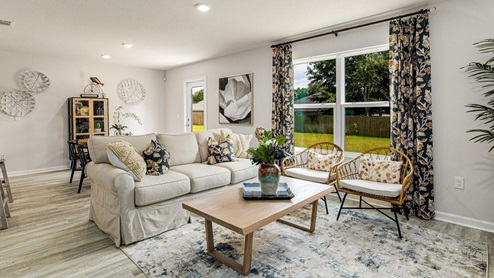 The Freeport living room with open concept dining room and kitchen