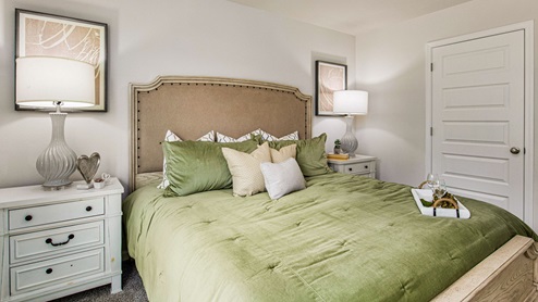 The Freeport primary bedroom with luxury carpet