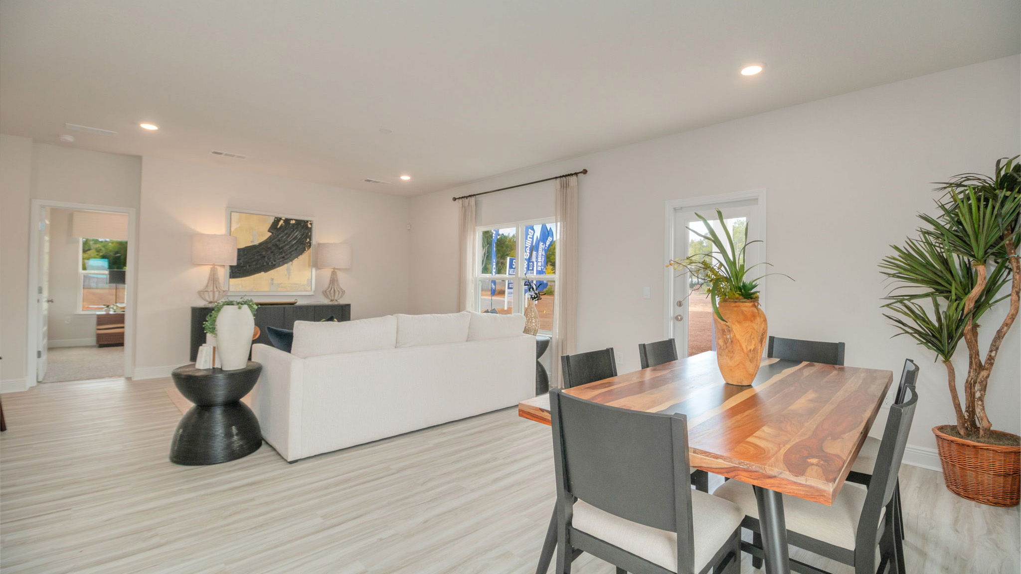 The Belfort floorplan dining room with EVP flooring throughout