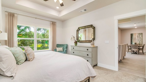 The Rhett primary bedroom with large window