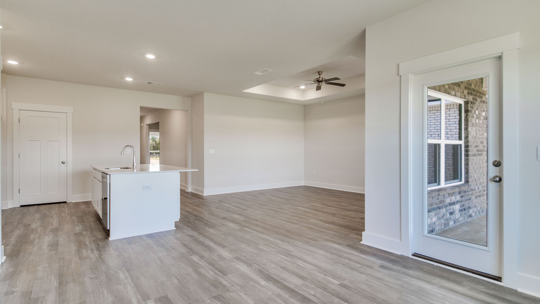 The Lamar floorplan kitchen with quartz countertops and stainless-steel appliances