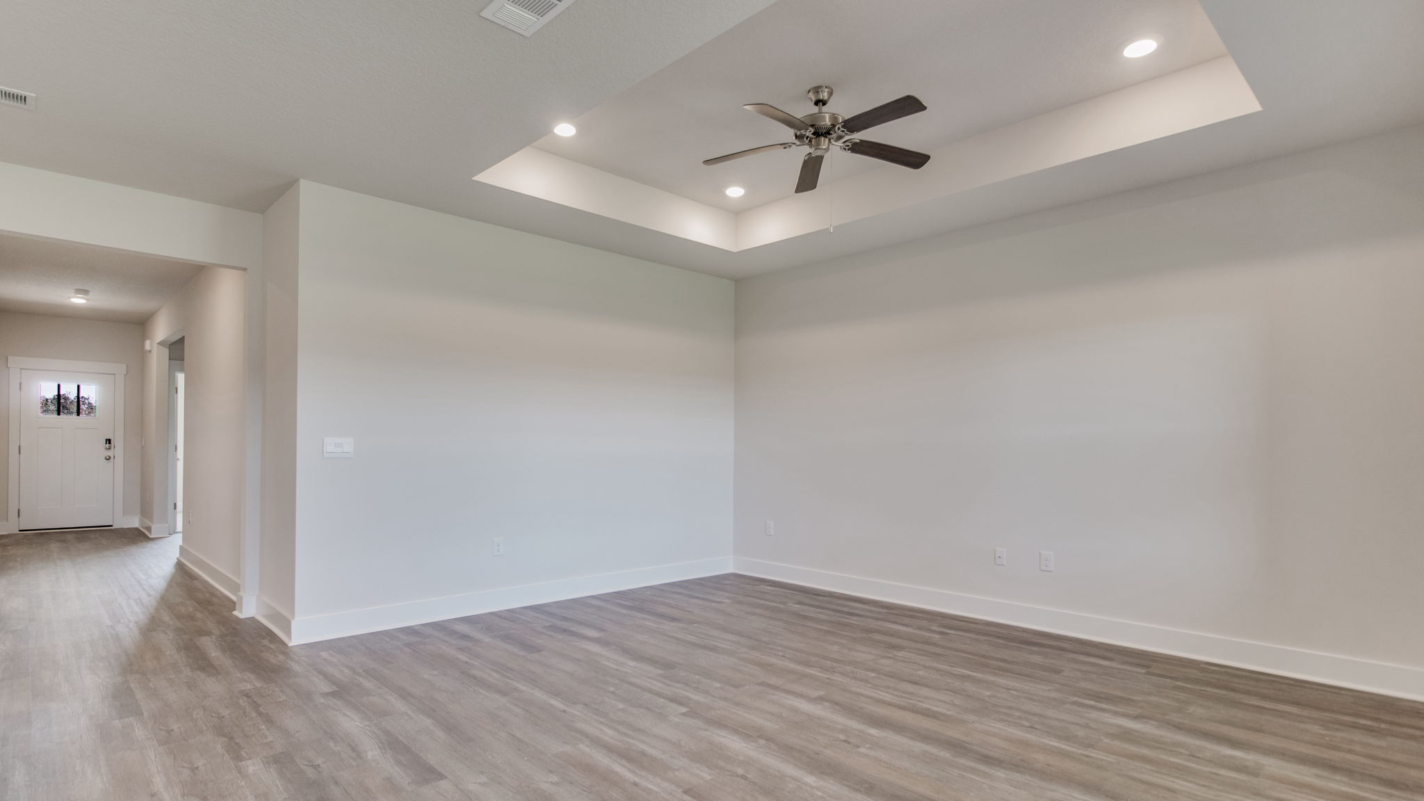The Lamar floorplan living room with tray ceiling