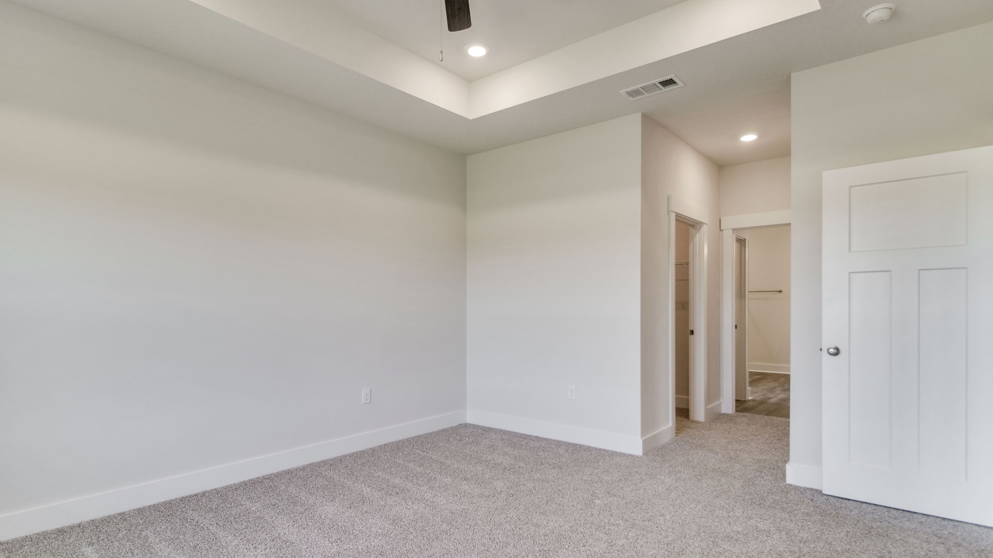 The Lamar floorplan primary bedroom with carpet throughout