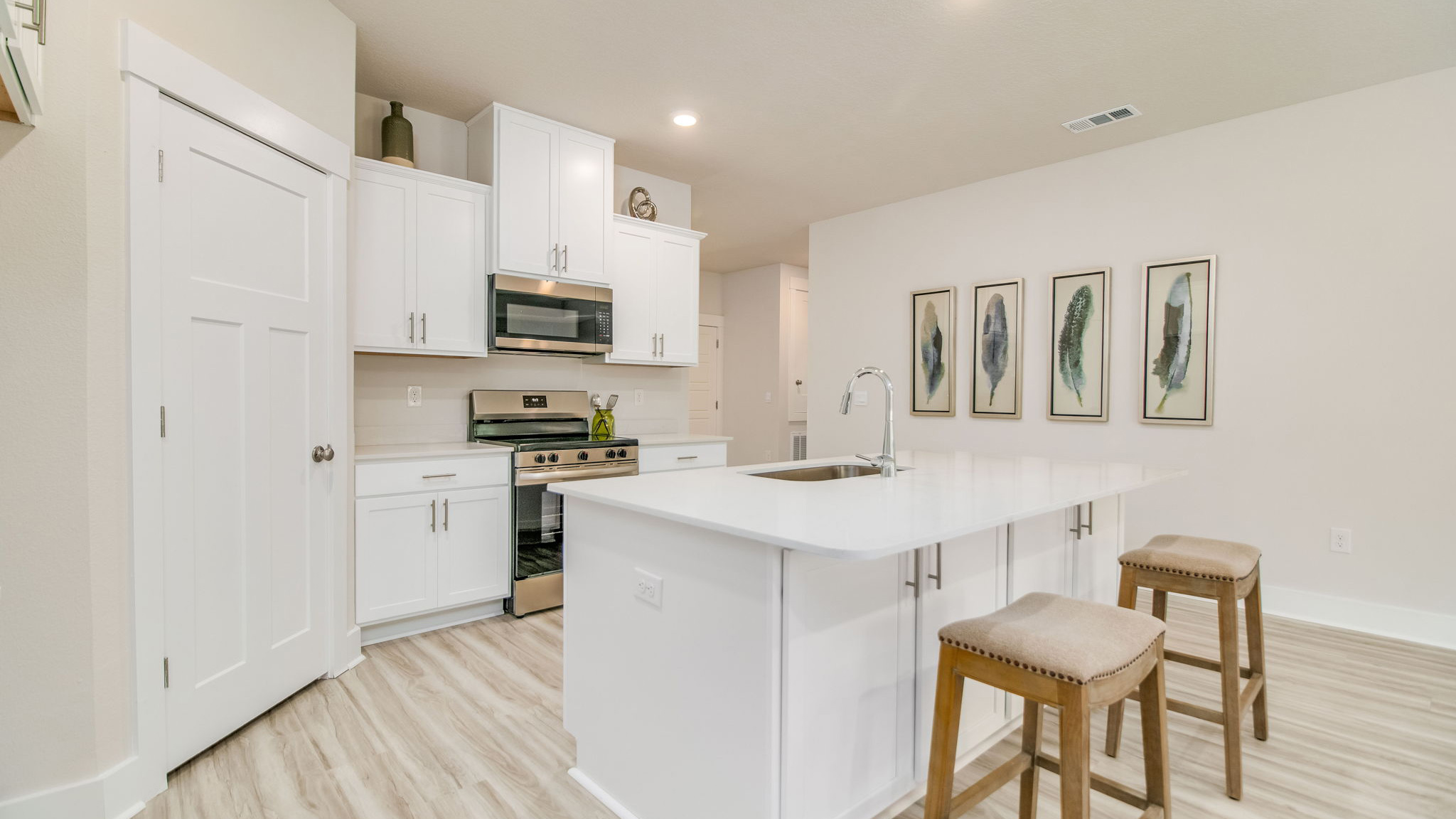 The Rhett floorplan kitchen with quartz countertops and stainless-steel appliances
