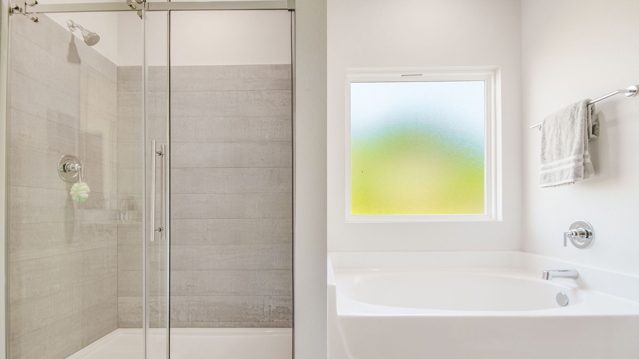 The Rhett floorplan primary bathroom with separate shower and soaking tub