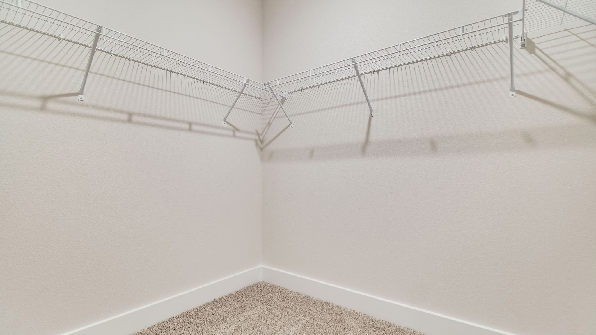 The Rhett floorplan primary closet with wire shelving