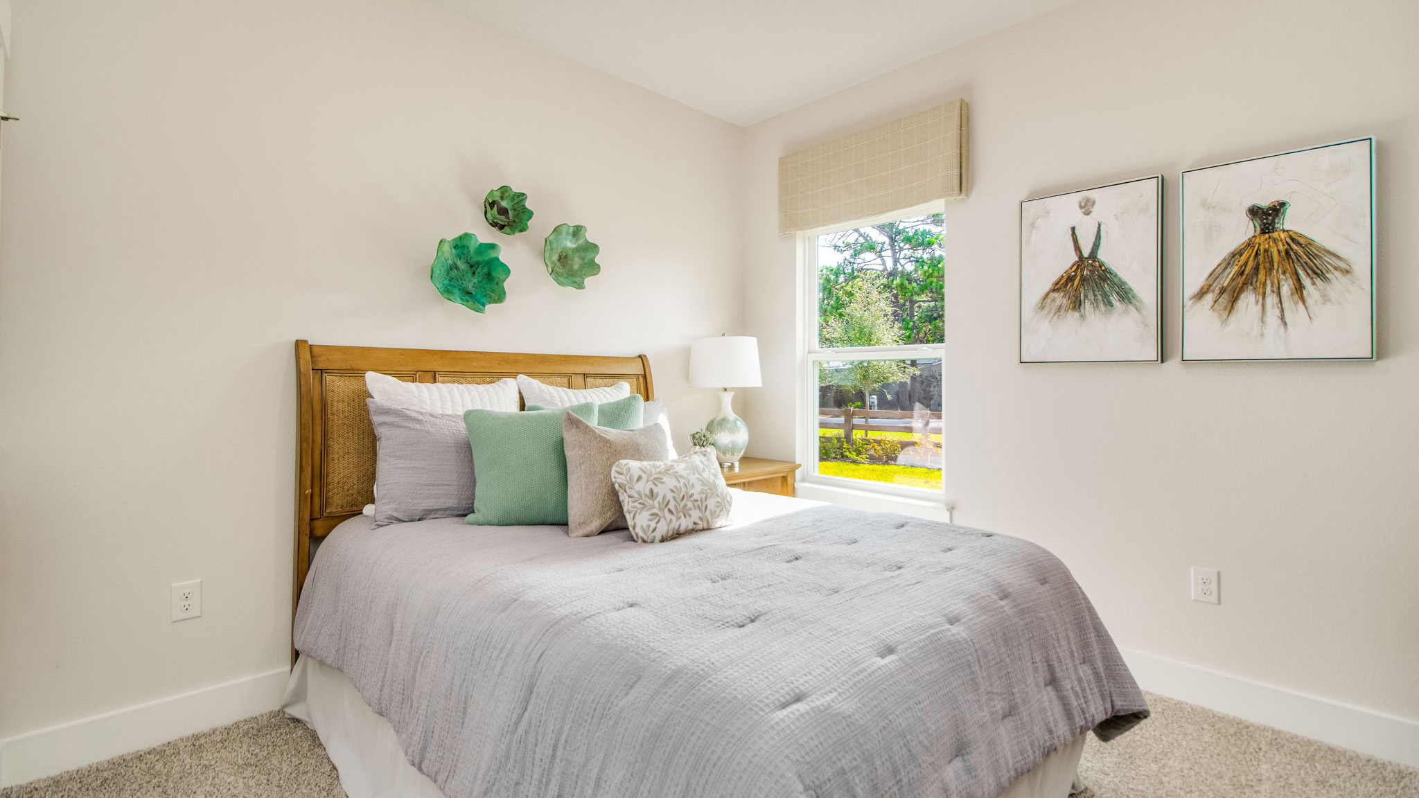 The Rhett floorplan guest bedroom three with carpet throughout