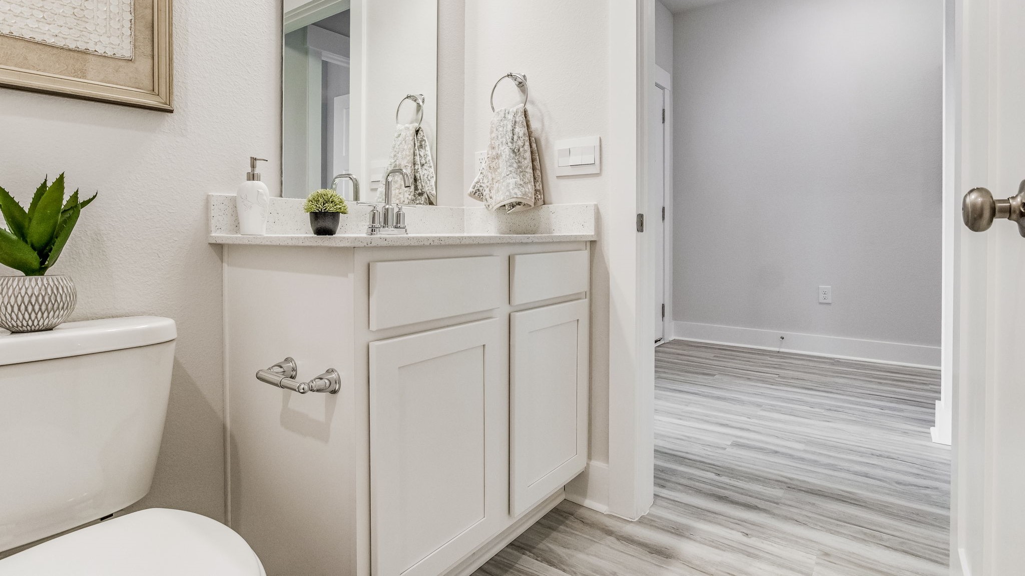 The Riverside floorplan guest bathroom with single vanity and quartz countertops
