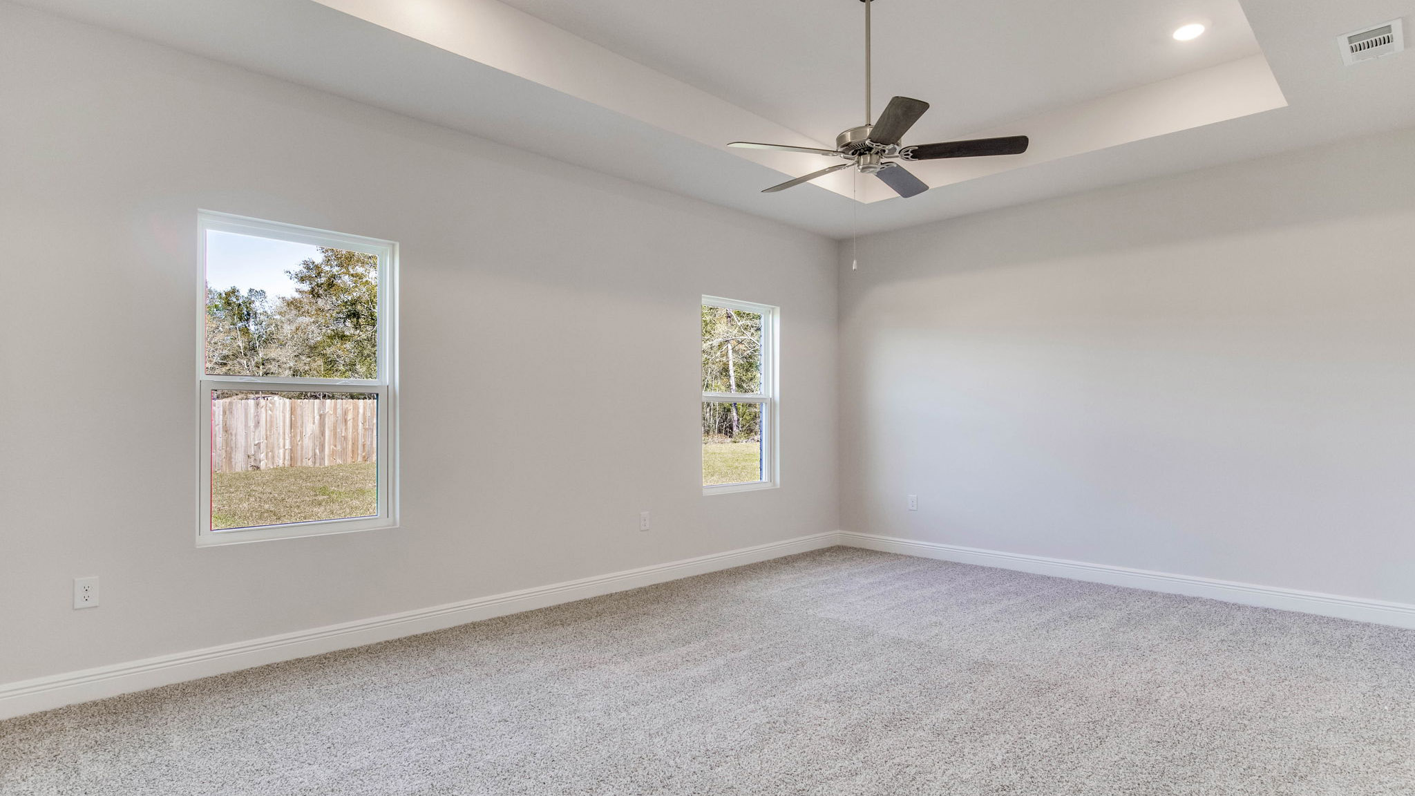 The Camden floorplan primary bedroom with two windows