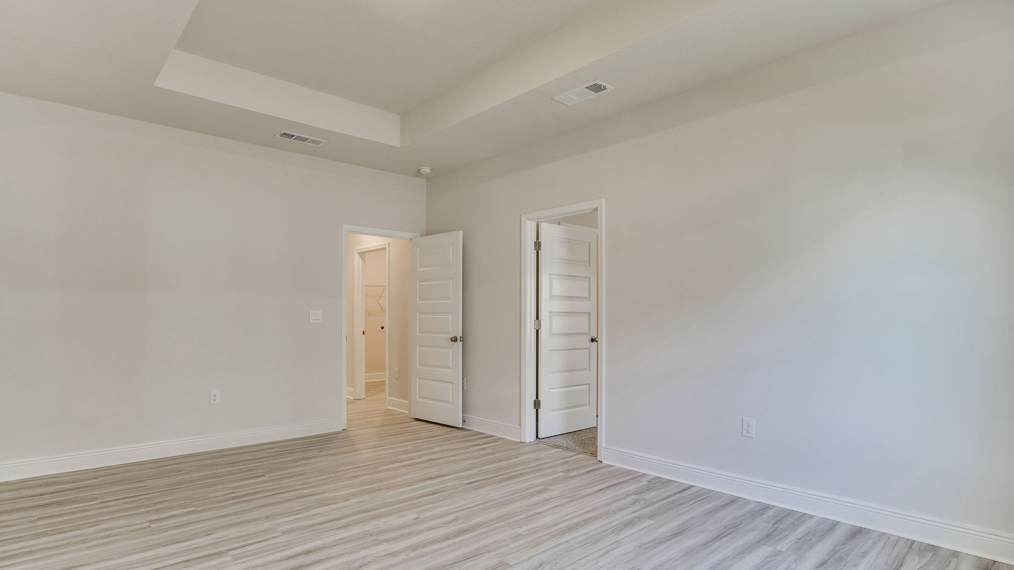 The Camden floorplan additional living space with EVP flooring throughout