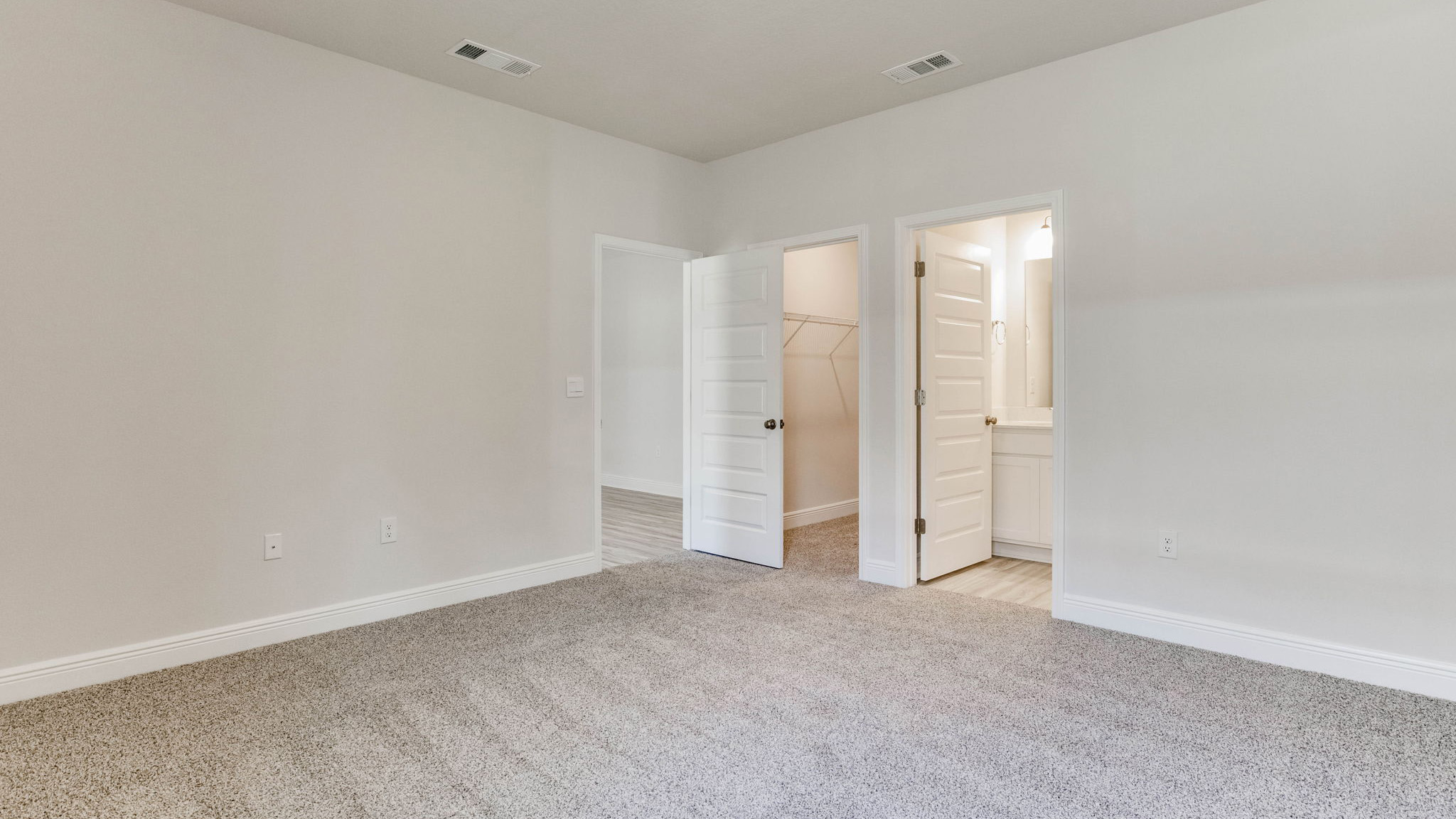 The Camden floorplan guest bedroom with carpet throughout