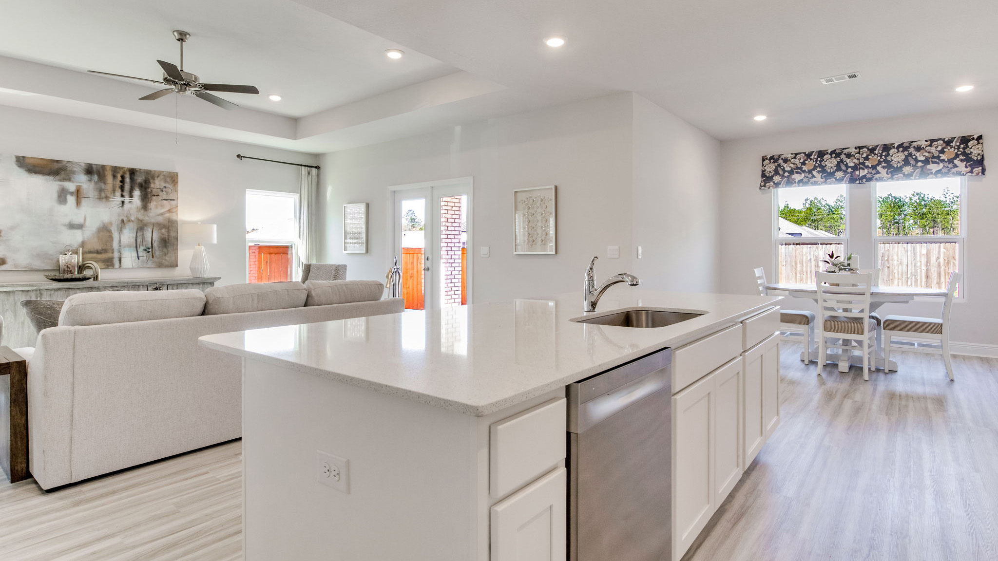 The Camden floorplan kitchen island with quartz countertops and stainless-steel appliances