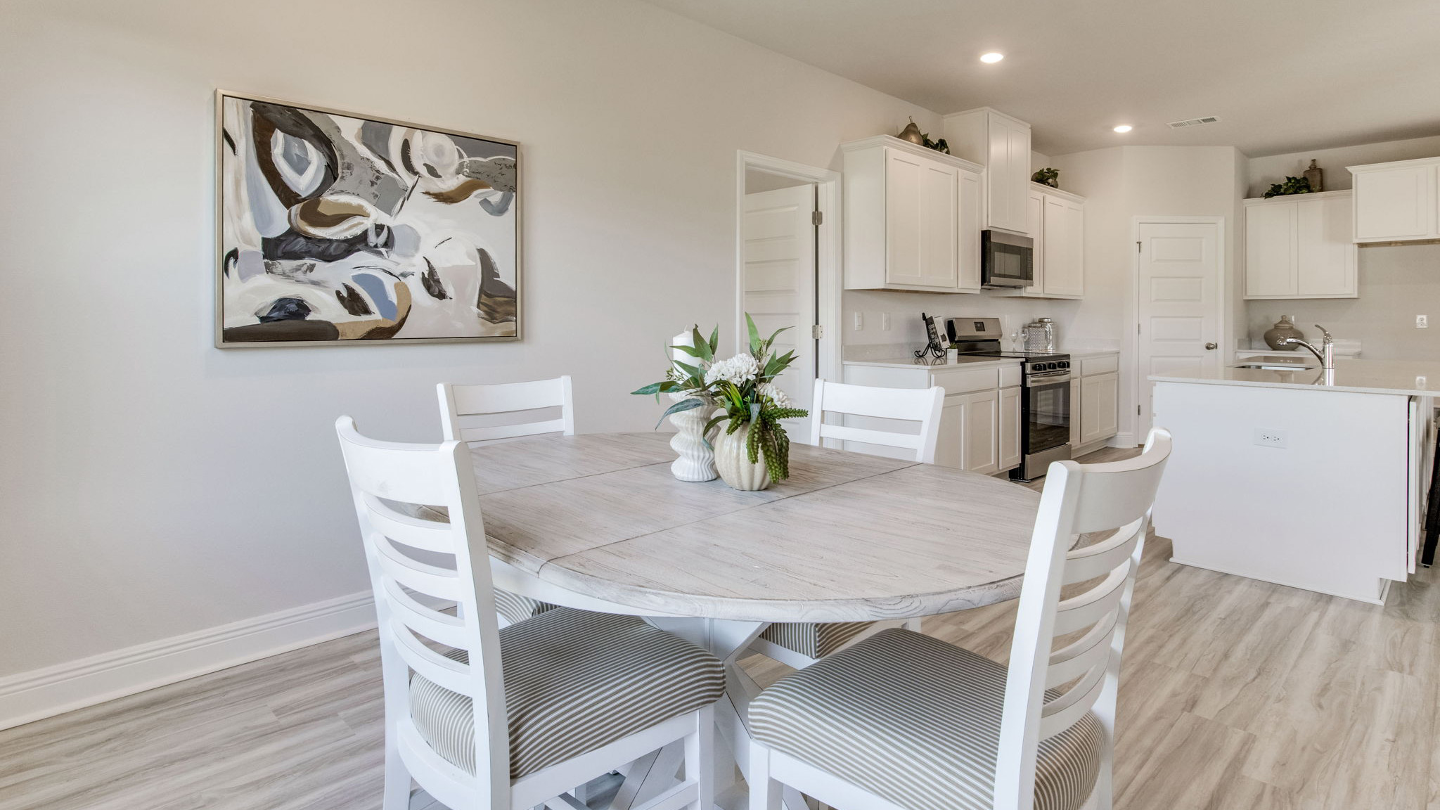 The Camden floorplan breakfast nook space with EVP flooring throughout