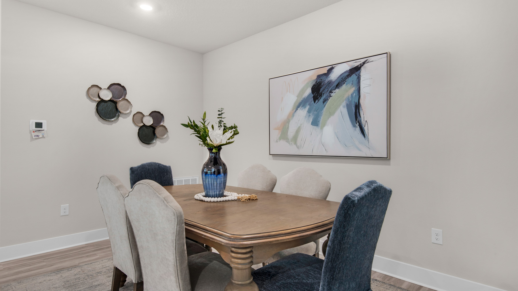 The Destin floorplan open concept dining room with EVP flooring throughout