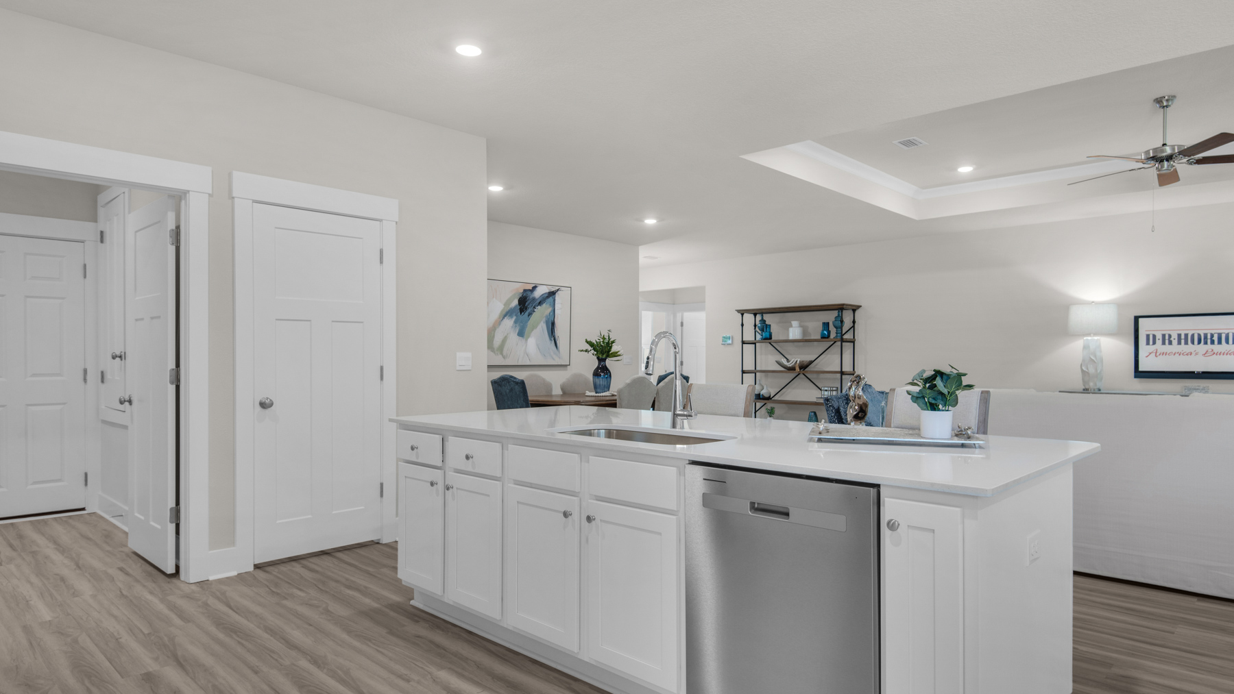 The Destin floorplan kitchen island with quartz countertops and stainless-steel appliances