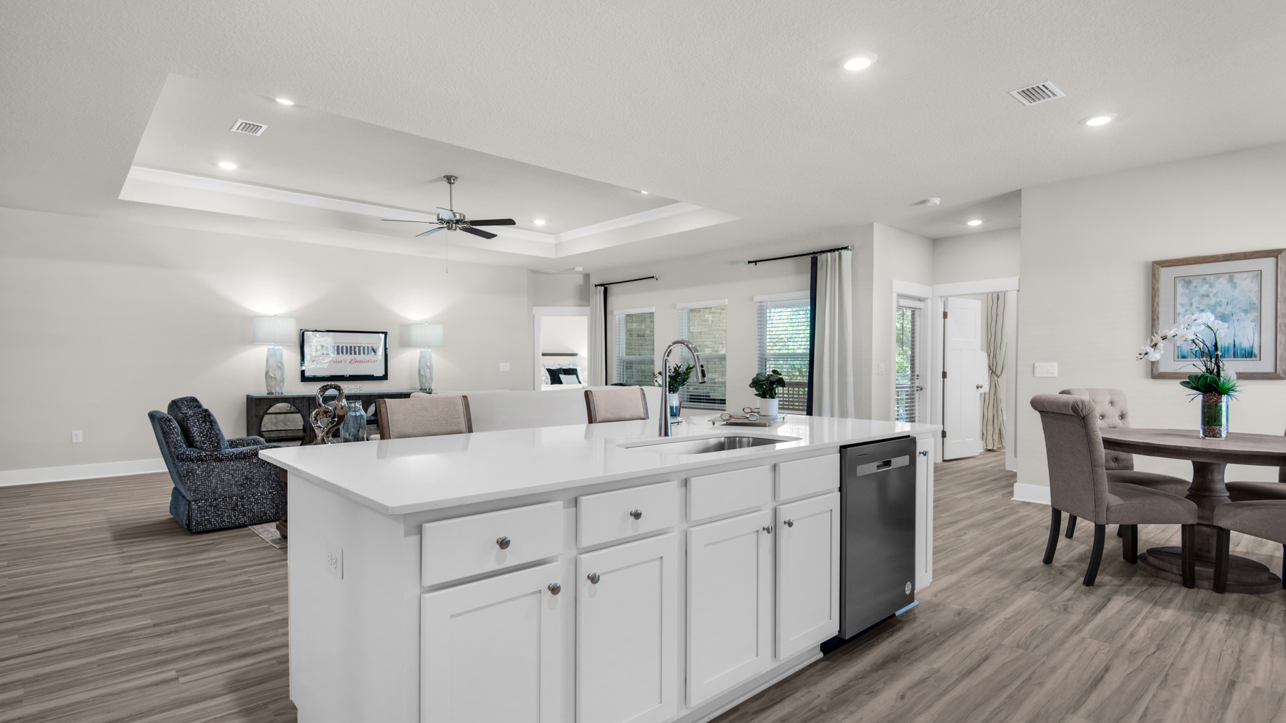 The Destin floorplan kitchen island with quartz countertops and stainless-steel appliances