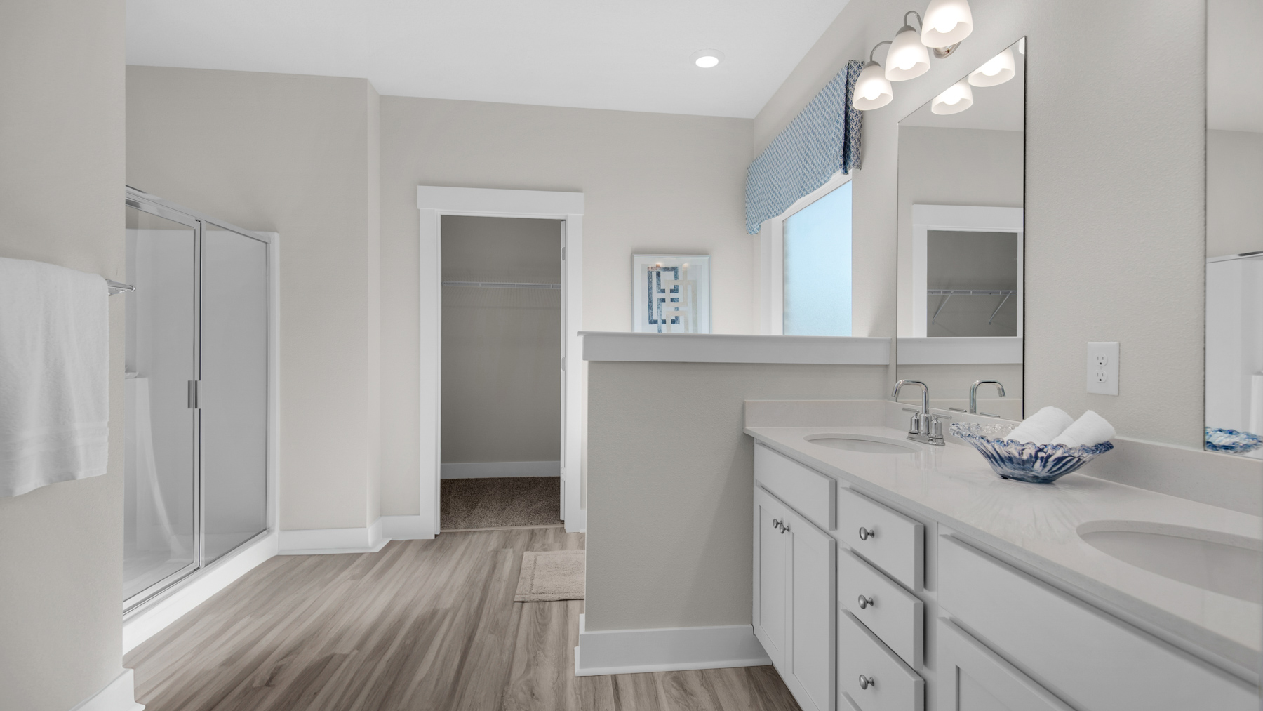 The Destin floorplan primary bathroom with EVP flooring throughout