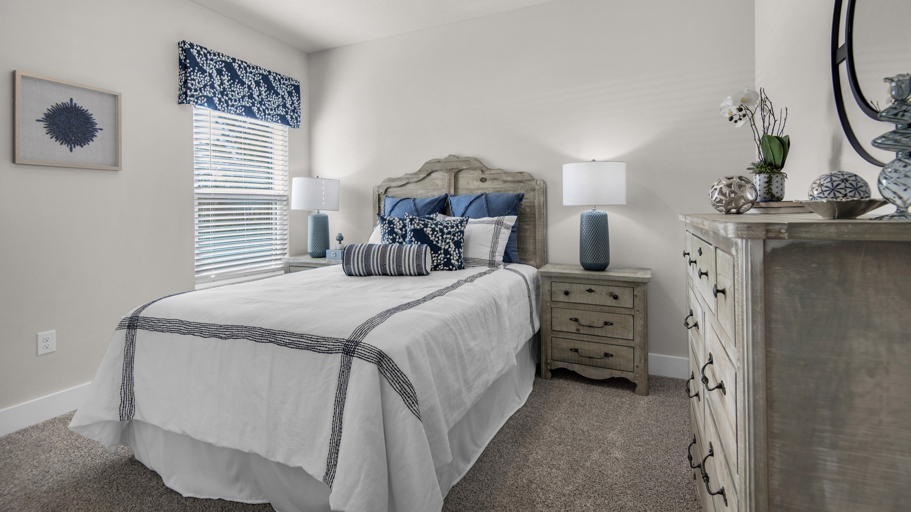 The Destin floorplan guest bedroom one with carpet throughout
