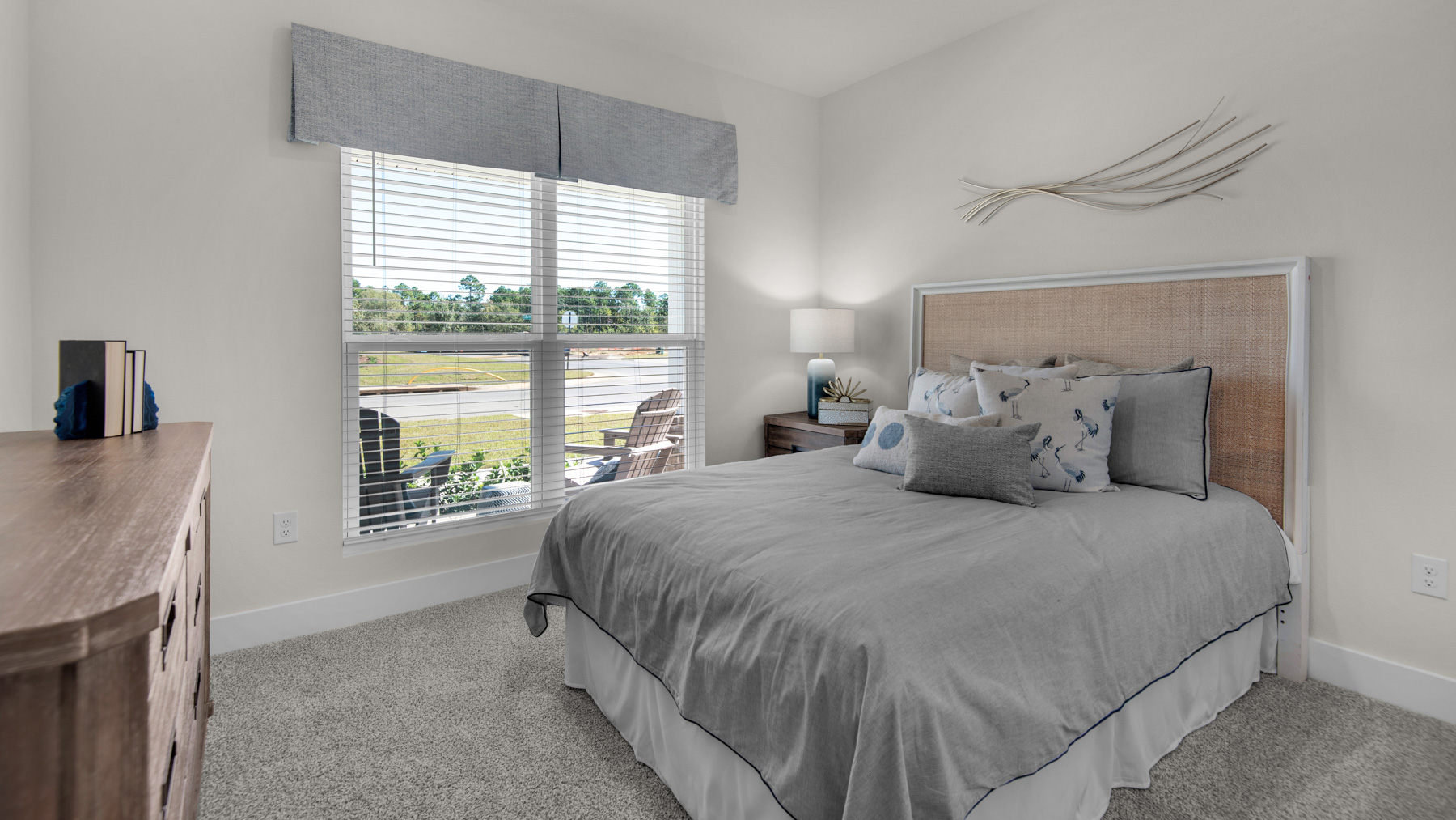 The Destin floorplan guest bedroom three with carpet throughout