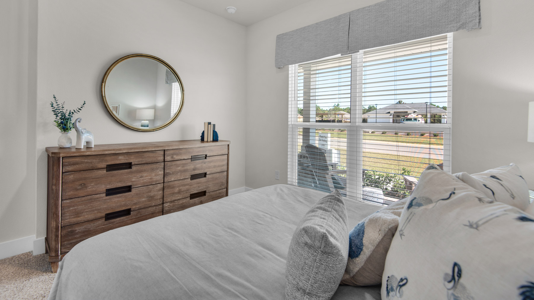 The Destin floorplan guest bedroom three with carpet throughout