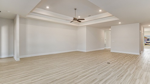The McKenzie floorplan living room with natural lighting
