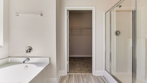 The McKenzie floorplan primary bathroom with separate shower and tub