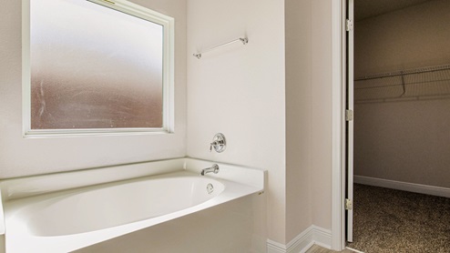 The McKenzie floorplan primary bathroom soaking tub