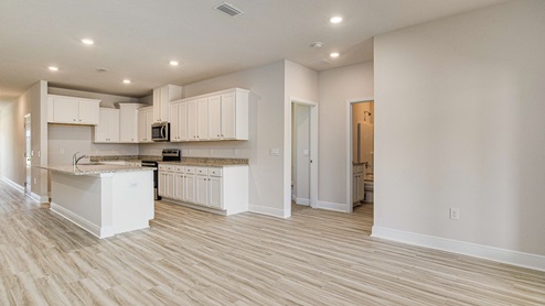 The McKenzie floorplan open kitchen and breakfast nook