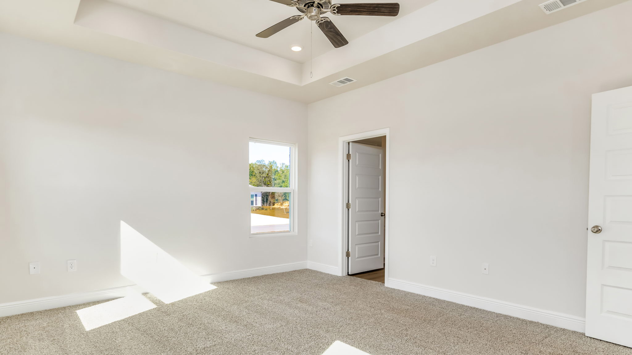 The Madison floorplan with tray ceilings and carpet throughout
