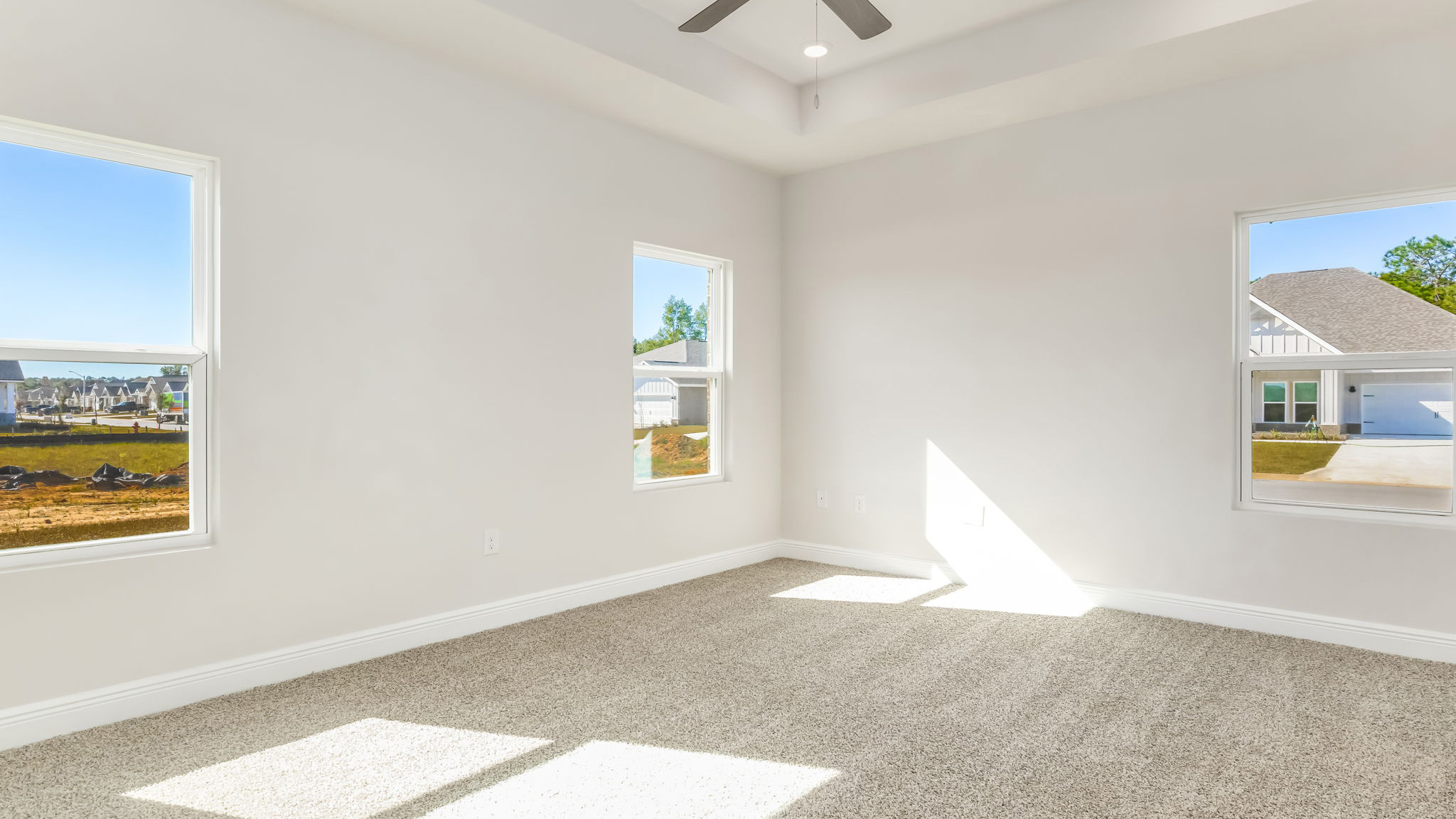 The Madison floorplan with tray ceilings and carpet throughout