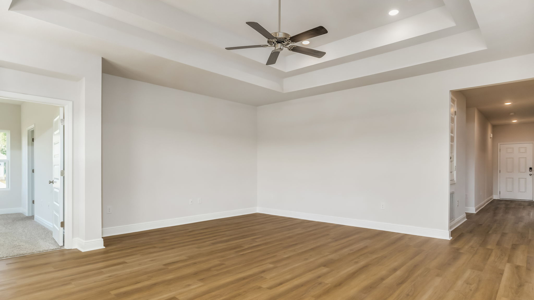 The Madison floorplan living room with tray ceilings