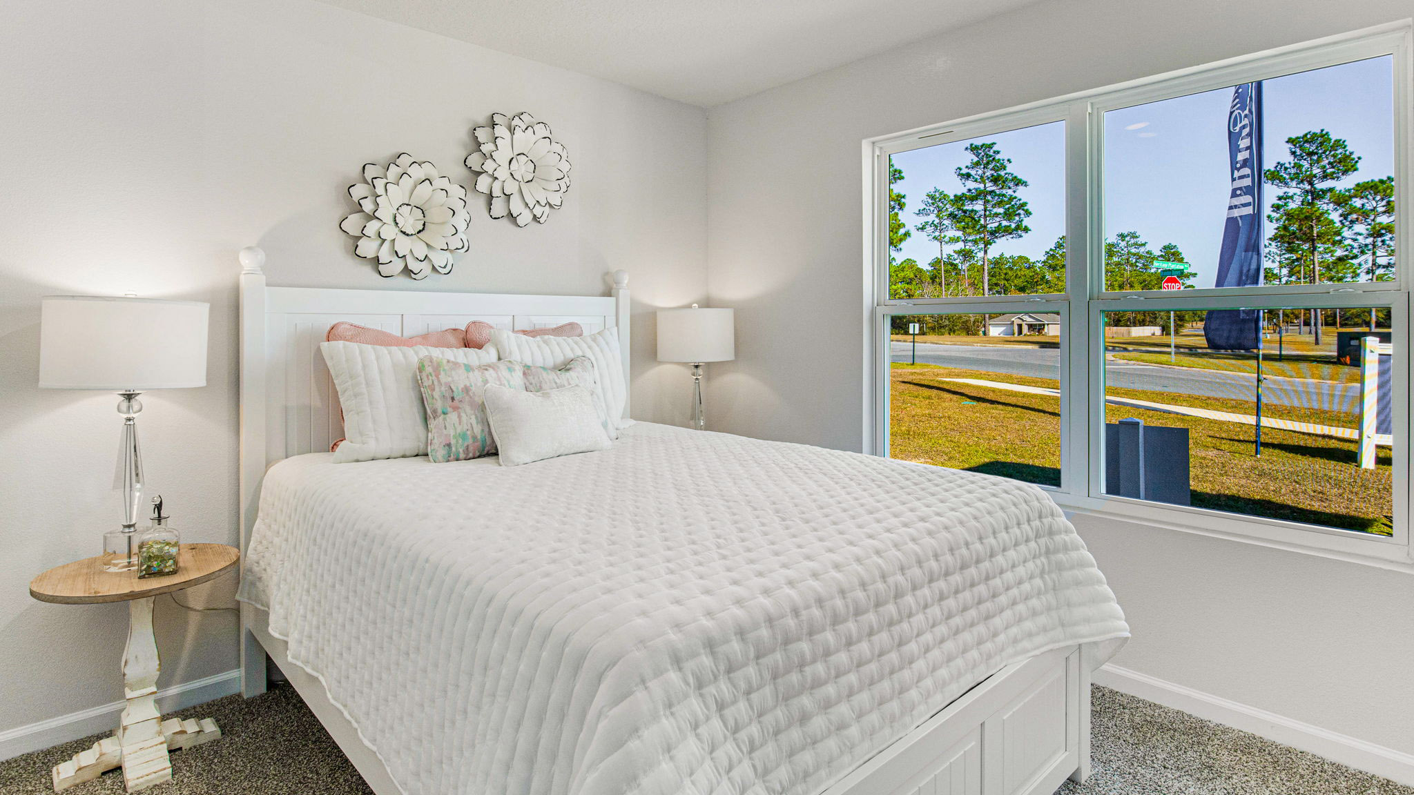 The Cali floorplan guest bedroom two with large window view