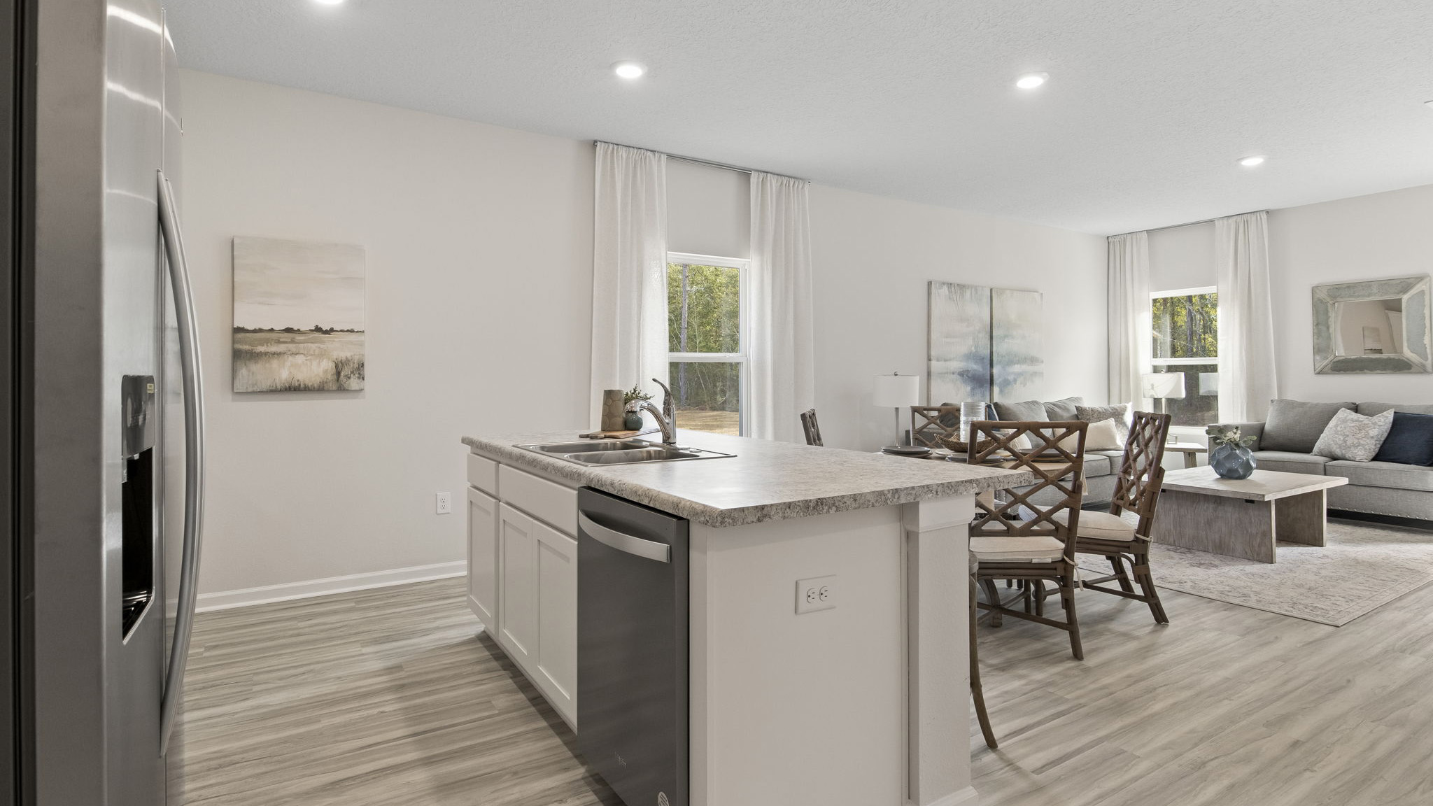 The Delilah floorplan kitchen island with stainless steel appliances