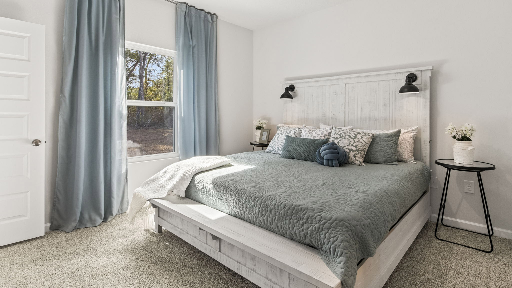 The Delilah floorplan primary bedroom with carpet throughout