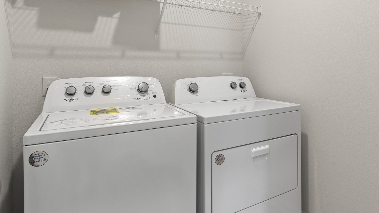 The Delilah floorplan laundry room with EVP flooring throughout