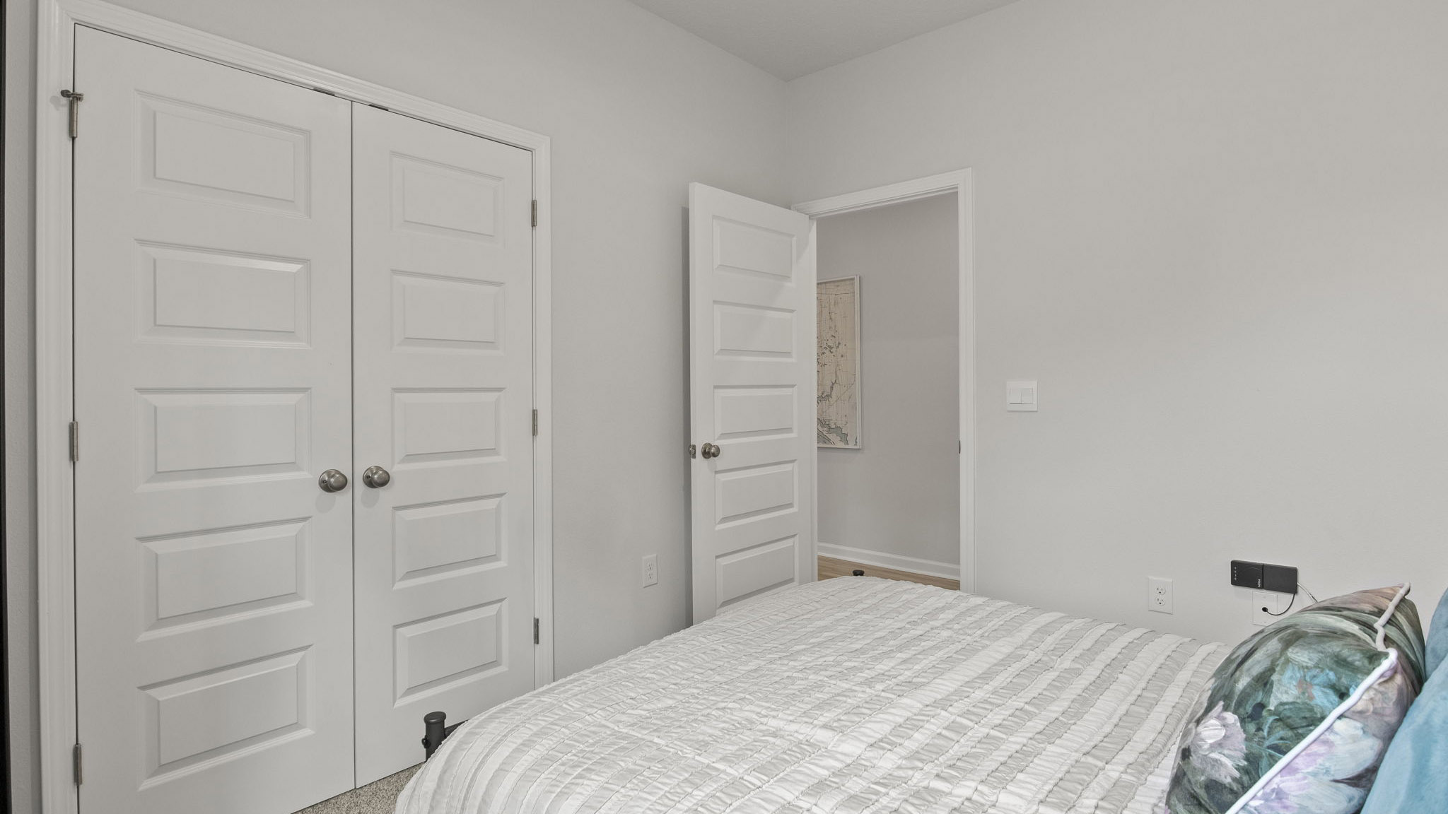 The Delilah floorplan guest bedroom one with carpet throughout