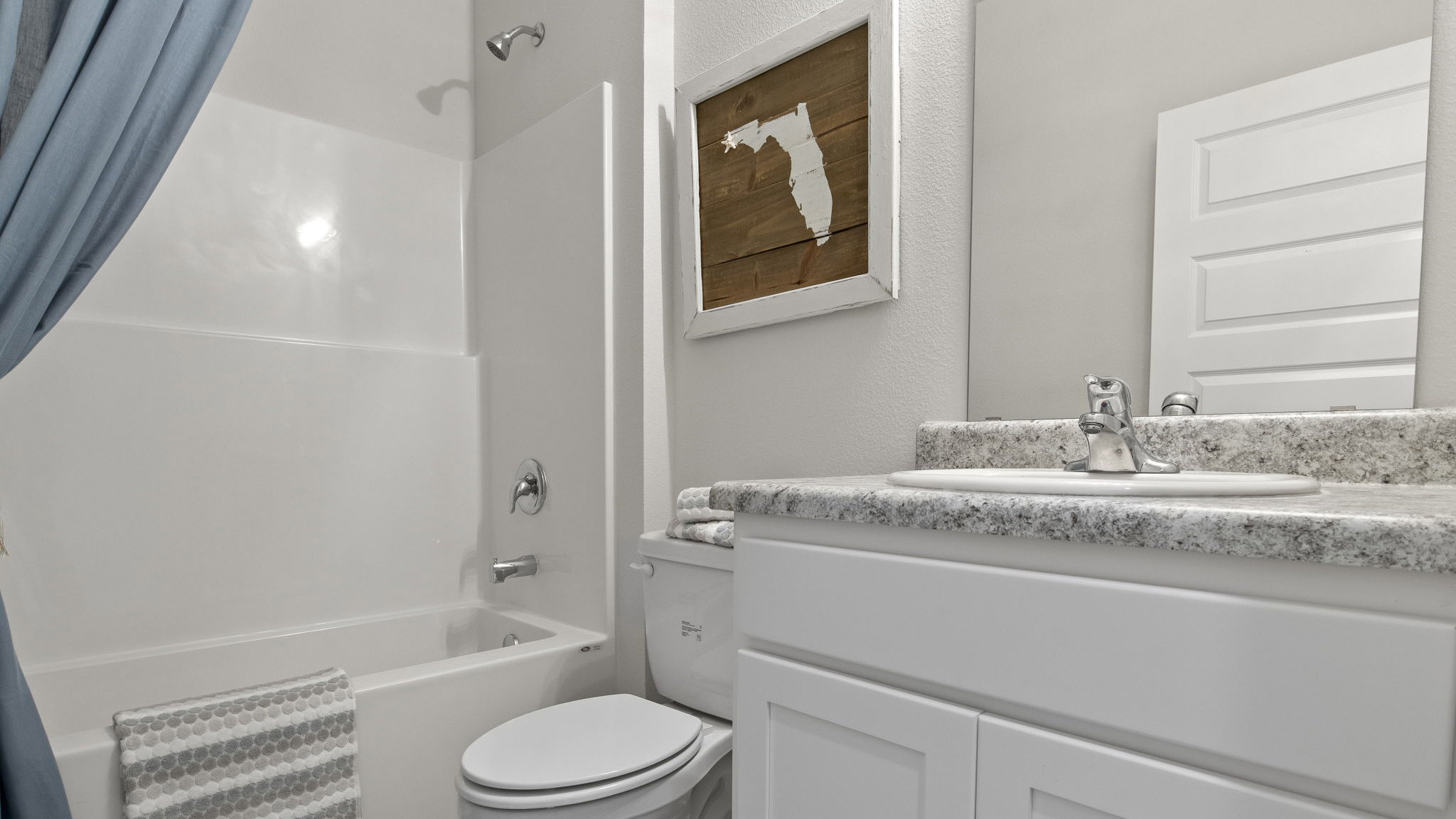 The Delilah floorplan guest bathroom with a shower tub combo and single vanity