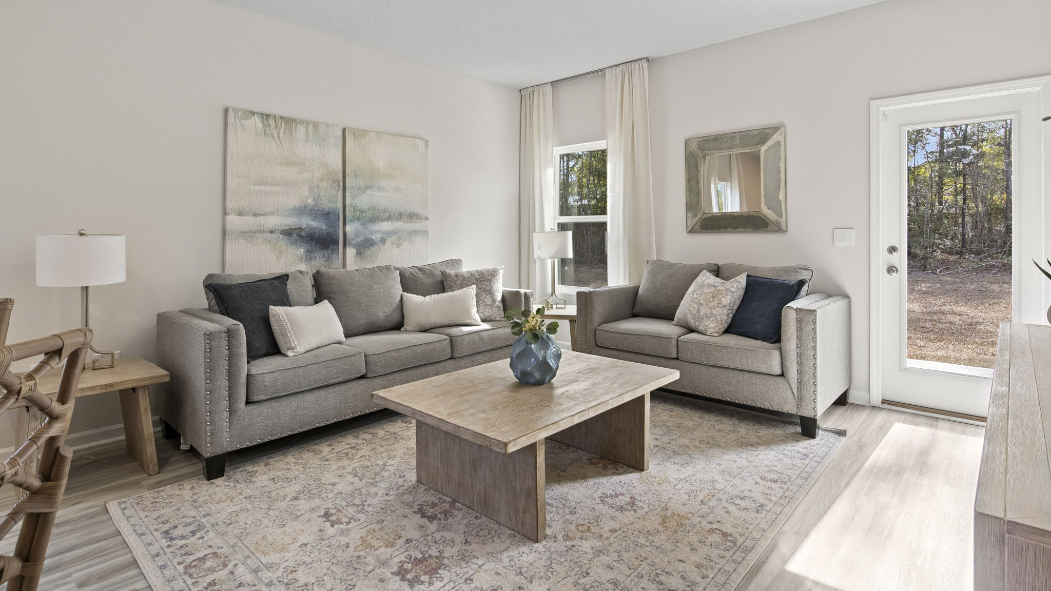 The Delilah floorplan living room with natural light from windows