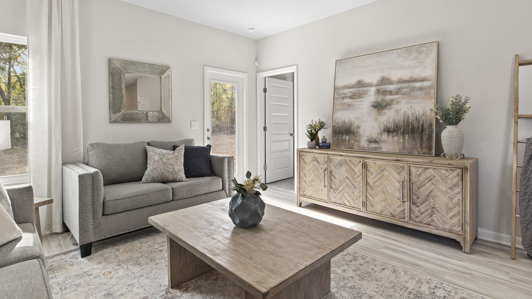 The Delilah floorplan living room with primary bedroom door view