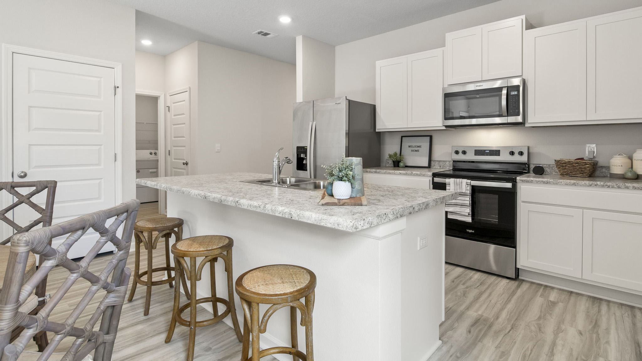 The Delilah floorplan kitchen with white shaker style cabinets