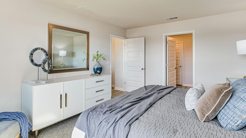 The Cali primary bedroom with luxury carpet