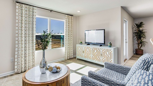 The Cali living room with EVP flooring throughout
